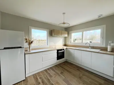 Cuisine ou kitchenette dans l'établissement Comme à la 