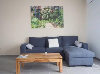 Coin salon dans l'établissement Maison 6-8 personnes 3 chambres