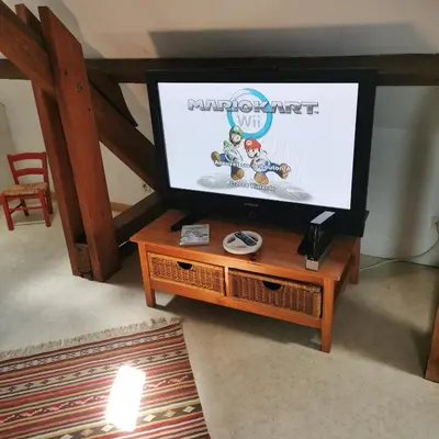 Télévision ou salle de divertissement dans l'établissement Gite idéalement situé aux portes de Bayeux