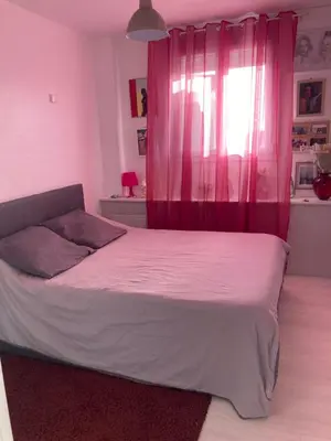 Un ou plusieurs lits dans un hébergement de l'établissement Appartement calme et ensoleillé