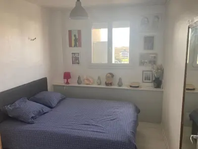 Un ou plusieurs lits dans un hébergement de l'établissement Appartement calme et ensoleillé