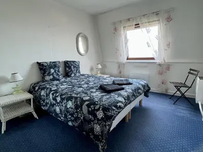 Un ou plusieurs lits dans un hébergement de l'établissement Duplex vue sur mer