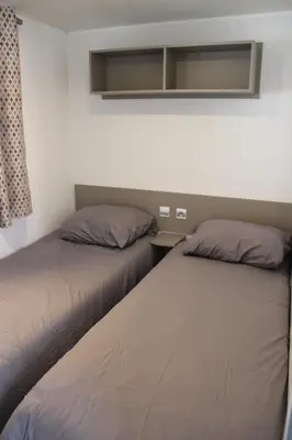 Un ou plusieurs lits dans un hébergement de l'établissement Mobil-home