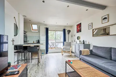 Coin salon dans l'établissement Au Jardin de Mel - Appt à moins d'1 km de la plage