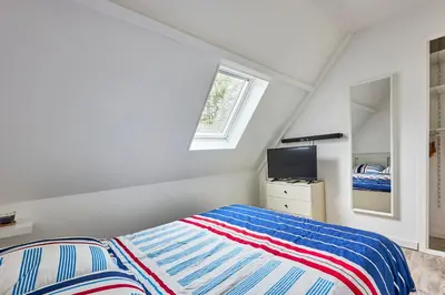 Un ou plusieurs lits dans un hébergement de l'établissement Au Jardin de Mel - Appt à moins d'1 km de la plage