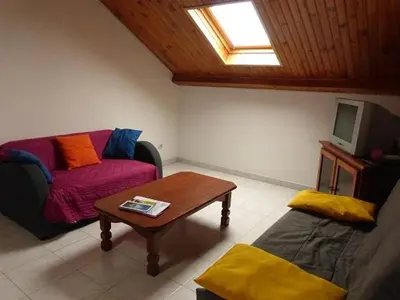 Coin salon dans l'établissement APPARTEMENT AVEC TERRASSE ET BARBECUE