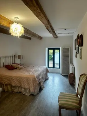 Un ou plusieurs lits dans un hébergement de l'établissement La Maison de Melman