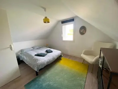 Un ou plusieurs lits dans un hébergement de l'établissement L'Océan, maison avec jardin clos