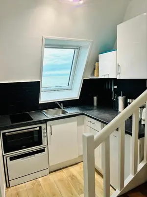 Cuisine ou kitchenette dans l'établissement Horizon plage