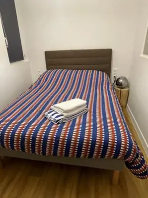 Un ou plusieurs lits dans un hébergement de l'établissement Charmante Maisonnette - 5 min du Pôle Hippique de Saint-Lô