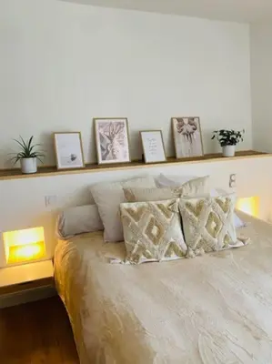 Un ou plusieurs lits dans un hébergement de l'établissement Maison de ville avec terrasse