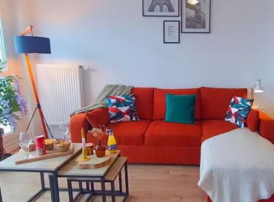 Coin salon dans l'établissement Appartement neuf - 3 chambres - 6 personnes - 73m² vue sur la ville