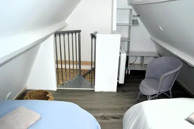 Un ou plusieurs lits dans un hébergement de l'établissement Petite vague - maison atypique avec terrasse