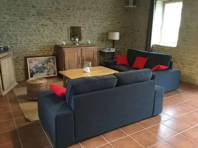 Coin salon dans l'établissement Gite Normand sur les plages du débarquement.