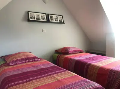 Un ou plusieurs lits dans un hébergement de l'établissement Gite Normand sur les plages du débarquement.