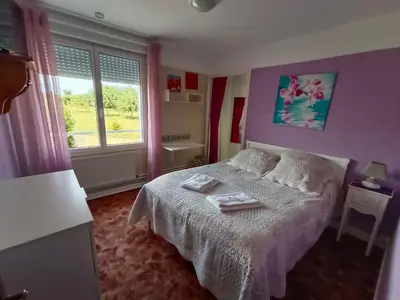 Un ou plusieurs lits dans un hébergement de l'établissement La cocotte normande