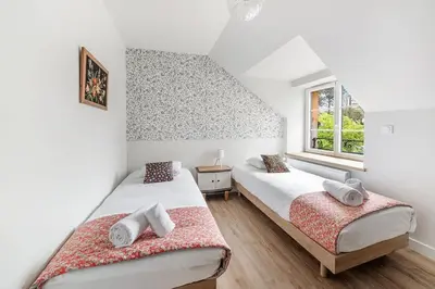 Un ou plusieurs lits dans un hébergement de l'établissement La Baie - Belle maison de charme -Jardin et Parking
