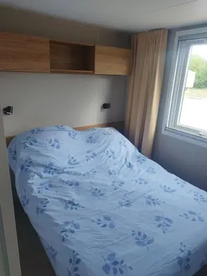 Un ou plusieurs lits dans un hébergement de l'établissement Mobil-home bord de mer