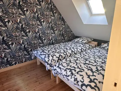 Un ou plusieurs lits dans un hébergement de l'établissement Gîte Cotentin Sweet Home