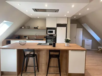 Cuisine ou kitchenette dans l'établissement La perle Bayeusaine