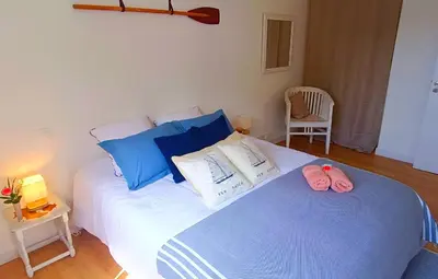 Un ou plusieurs lits dans un hébergement de l'établissement Maison neuve proche plage avec parking gratuit et privé à 5 min du musée de la Batterie de Merville