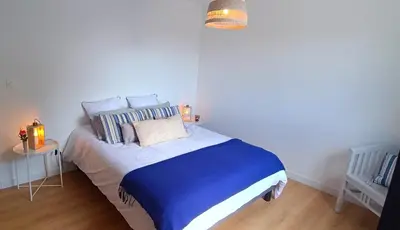 Un ou plusieurs lits dans un hébergement de l'établissement Maison neuve proche plage avec parking gratuit et privé à 5 min du musée de la Batterie de Merville