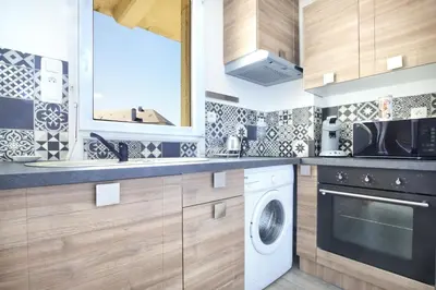 Cuisine ou kitchenette dans l'établissement En bord de mer - Appt à moins d'un km de la plage