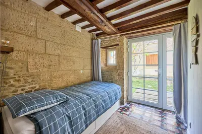 Un ou plusieurs lits dans un hébergement de l'établissement Augustine Beach - Maison à 700 m de la plage