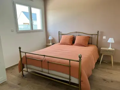 Un ou plusieurs lits dans un hébergement de l'établissement Gîte des couleurs