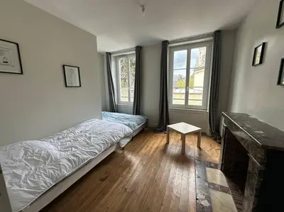 Un ou plusieurs lits dans un hébergement de l'établissement Maison centre historique