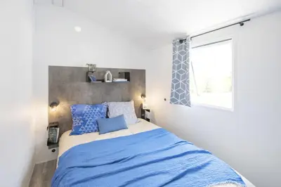 Un ou plusieurs lits dans un hébergement de l'établissement Bungalow Bord de mer
