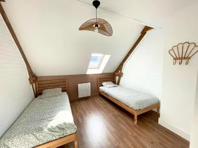 Un ou plusieurs lits dans un hébergement de l'établissement Gîte la Coquille - Chaleureux & paisible