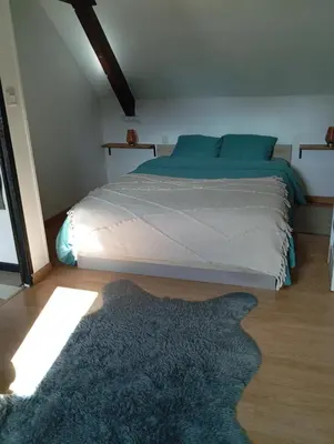 Un ou plusieurs lits dans un hébergement de l'établissement La Petite Maison Cosy