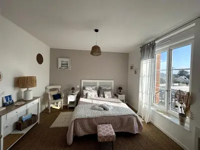 Un ou plusieurs lits dans un hébergement de l'établissement Appartement de la plage