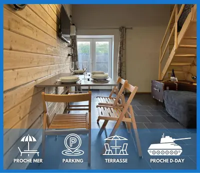 Coin salon dans l'établissement Hortansia apt rénové bien équipé avec terrasse aménagée jardin, parking privé, proche de la mer, près de Port en Bessin et Omaha Beach