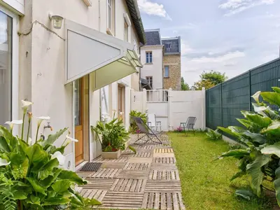 Jardin de l'établissement Maison de vacances familiale près des commerces et plage à Merville Franceville - FR-1-788-10
