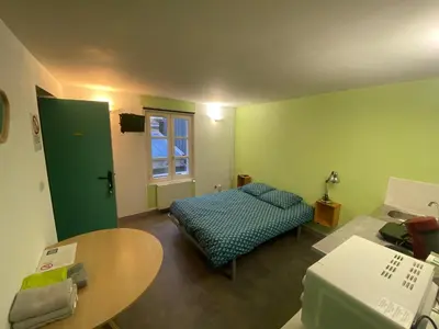 Un ou plusieurs lits dans un hébergement de l'établissement Appartement ou chambre centre cherbourg