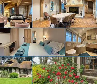 Coin salon dans l'établissement Chant des mouettes Maison rénovée spacieuse tout confort grand jardin belle terrasse aménagée parking 8 personnes 4 sdb 5 wc à 10 mn à pied de la mer Port en Bessin tous commerces restaurants proche Omaha Beach