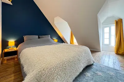 Un ou plusieurs lits dans un hébergement de l'établissement Appart de charme, 2 chambres en centre ville