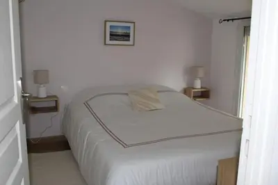 Un ou plusieurs lits dans un hébergement de l'établissement Maison jardin proximité Bayeux, Arromanches