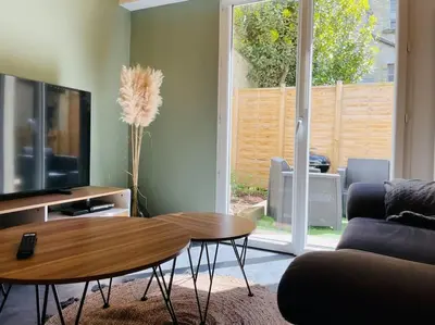 Télévision ou salle de divertissement dans l'établissement L'Alma 8 : Le Calme au Coeur de Cherbourg