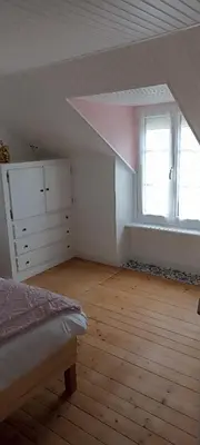Un ou plusieurs lits dans un hébergement de l'établissement Chez titine gîte du Bon Accueil