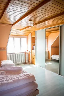 Un ou plusieurs lits dans un hébergement de l'établissement Séjour détente à deux pas de la mer Gîte de caractère
