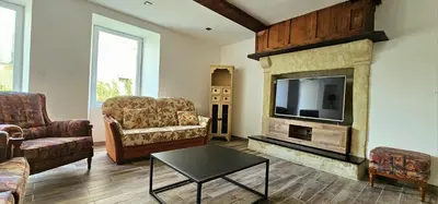 Coin salon dans l'établissement Maison Saint Côme du Mont