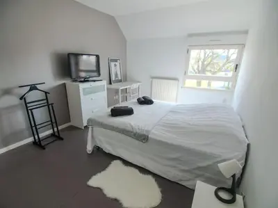 Un ou plusieurs lits dans un hébergement de l'établissement Appartement terrasse