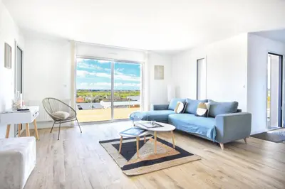 Coin salon dans l'établissement Les Euphorbes - Charmante maison avec vue mer