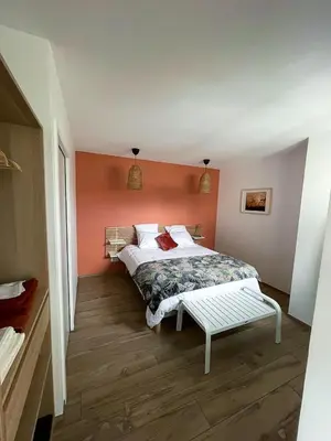 Un ou plusieurs lits dans un hébergement de l'établissement appartements guesthouse1 et guesthouse2 sword beach