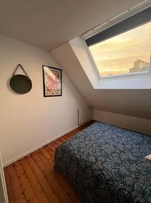 Un ou plusieurs lits dans un hébergement de l'établissement Grand appartement vue théâtre Hyper Centre