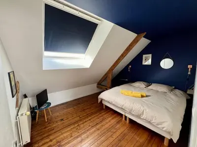 Un ou plusieurs lits dans un hébergement de l'établissement Grand appartement vue théâtre Hyper Centre