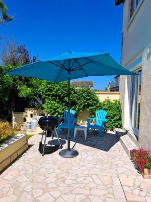 Jardin de l'établissement Le Caprice de la mer - maison avec véranda, jardin